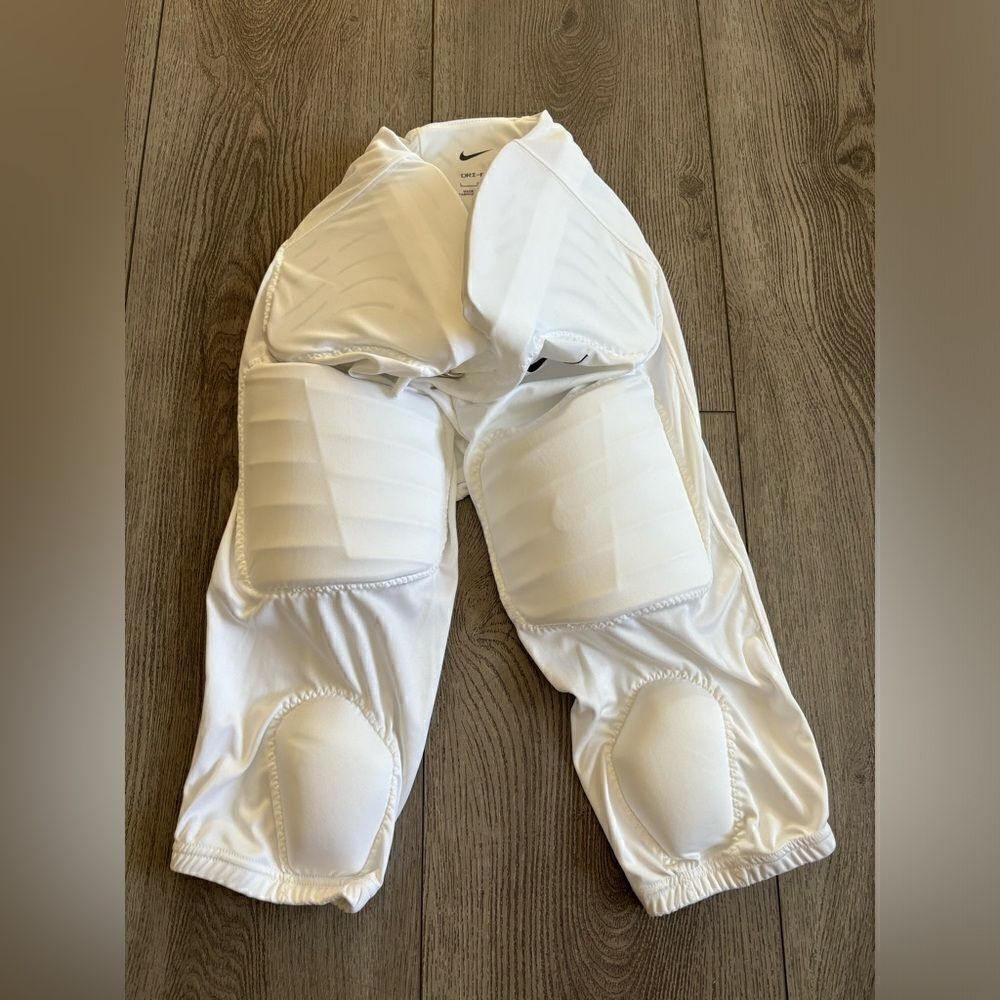 Nike boys football pants with padding